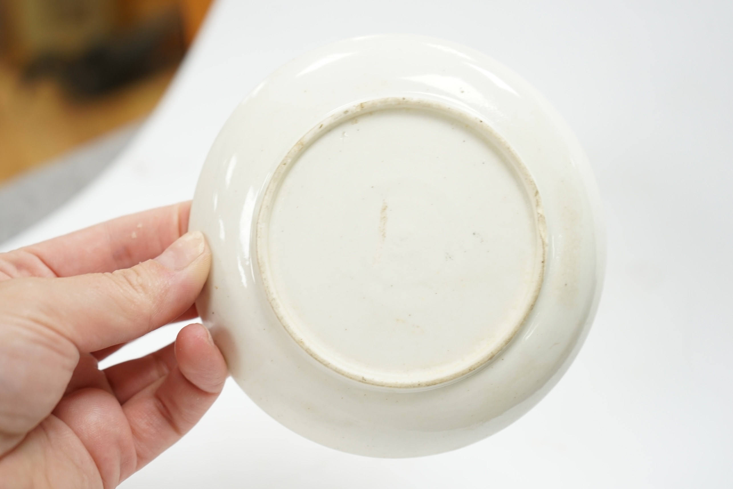 A Bow prunus sprigged coffee cup and saucer, c.1760, saucer 11.5cm diameter, cup 6cm high. Condition - cup has a chip to the rim and both saucer and cup interior have wear to glazing